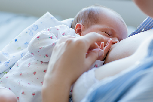 benefits of breastfeeding for newborns. happy motherhood. family values.